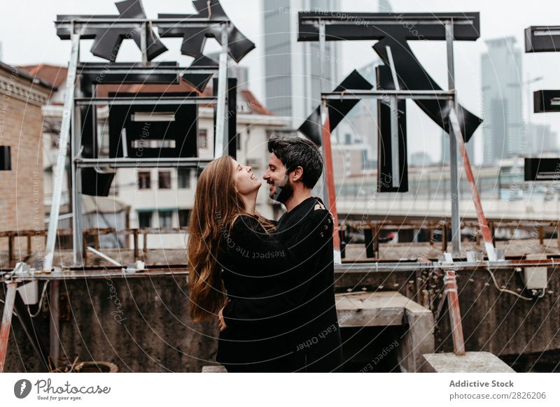 Happy couple on rooftop Couple Embrace City Love Vantage point Kissing romantic Together Beautiful Youth (Young adults) Man Woman Romance Relationship Happiness