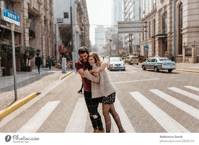 Beautiful couple hugging on crosswalk Couple Embrace Street City Walking Together Happy Lifestyle Man Girl Woman Town Pedestrian Pedestrian crossing