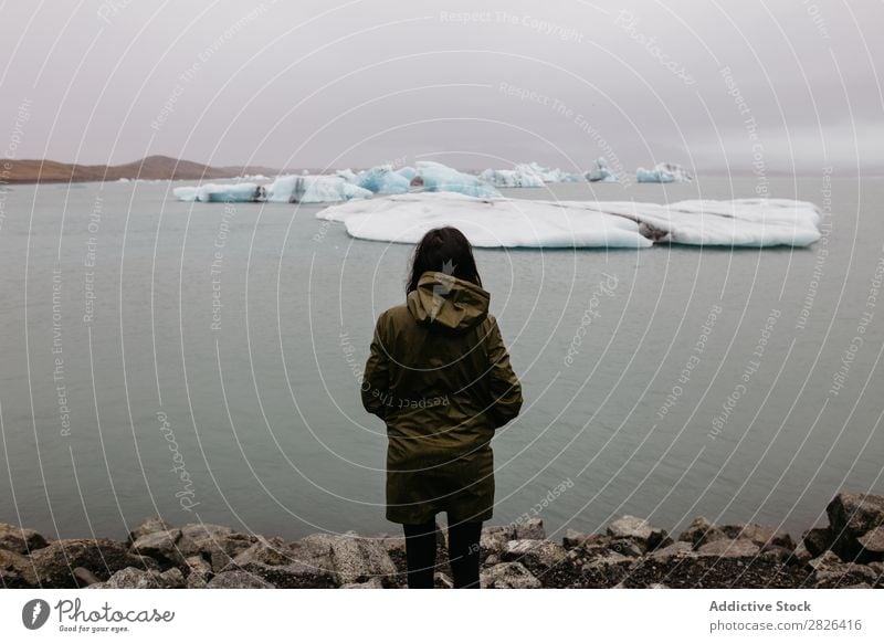 Anonymous woman looking at glacier Woman Ocean Glacier Nature Ice Landscape Vacation & Travel Tourism Iceland Environment Iceberg Winter White severe polar
