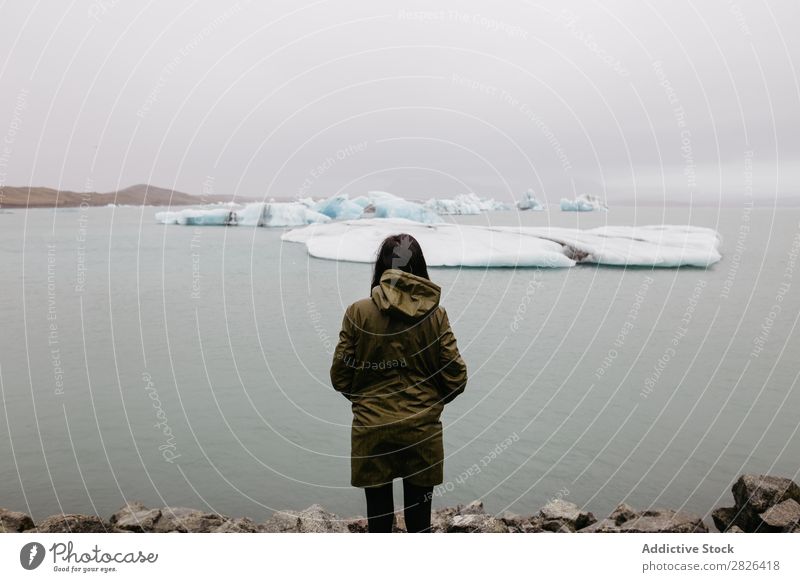 Anonymous woman looking at glacier Woman Ocean Glacier Nature Ice Landscape Vacation & Travel Tourism Iceland Environment Iceberg Winter White severe polar