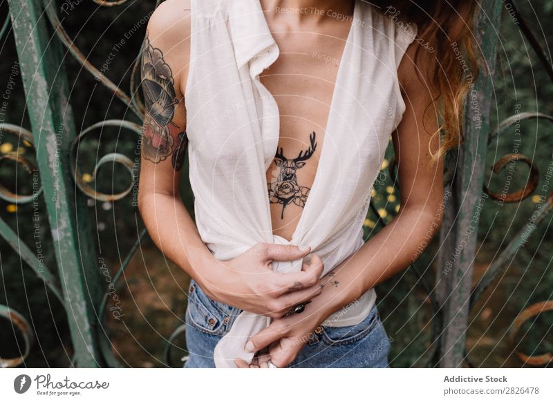 Tattooed girl. Eroticism Woman Low neckline long neck Breasts Body Deer Conceptual design Uniqueness Close-up Crops Portrait photograph Horizontal Human being