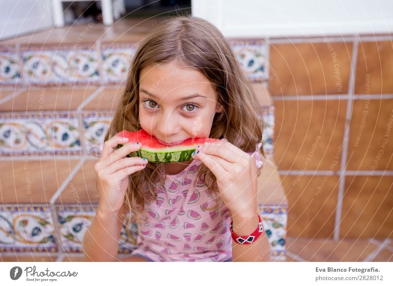 Beautiful kid girl eating watermelon at home Fruit Ice cream Eating Joy Happy Vacation & Travel Summer House (Residential Structure) Garden Child Friendship