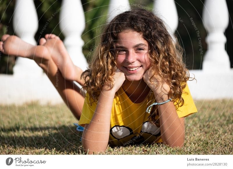 lying down and playing with her legs Joy Happy Beautiful Face Summer Sun Garden Success Human being Woman Adults Nature Grass T-shirt Blonde Smiling Laughter