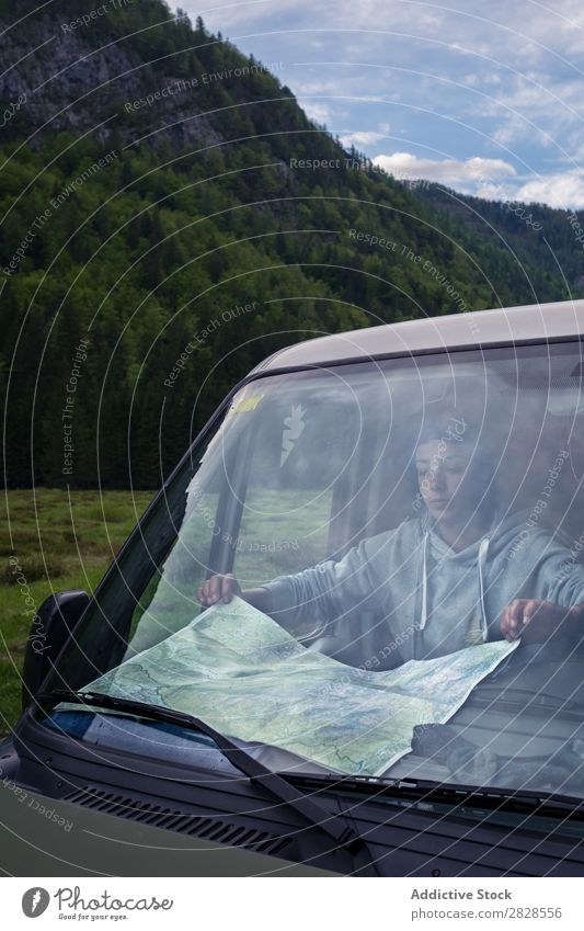 Tourist looking at map Map Car Mountain Trip Street Vacation & Travel Woman Lifestyle Adventure Nature Vehicle Youth (Young adults) Human being Adults Drive