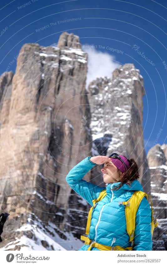 Woman tourist in mountains Snow Mountain Tourist Backpack Looking away Smiling Vacation & Travel Winter Hiking Adventure Landscape Nature trekking Extreme hiker