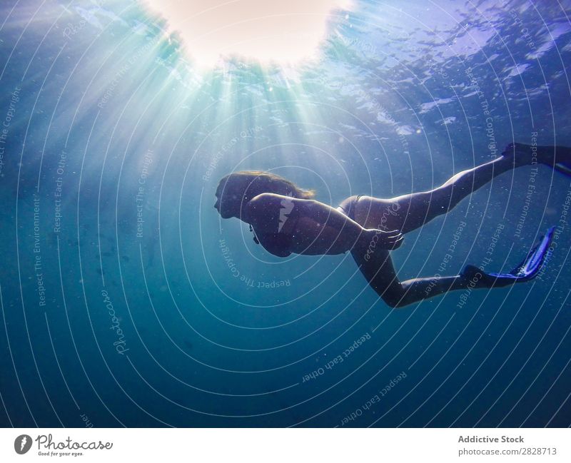 Woman swimming underwater Underwater photo Ocean Swimming flippers silence Body Relaxation Nature Beauty Photography Dive Sports Blue Float in the water