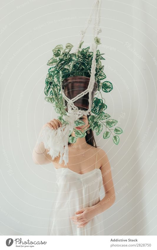 Young woman holding cache pot Woman pretty Youth (Young adults) Beautiful Strick rope Hanging Plant Houseplant Brunette Attractive Human being