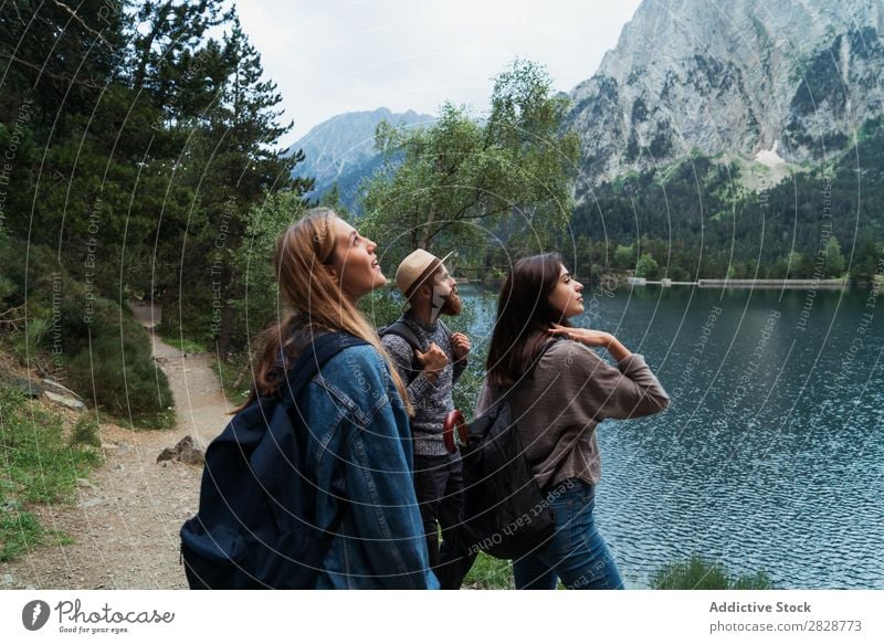 Happy friends in mountains Woman Man Mountain Joy Posture Together Hiking Lake Water Cheerful Vacation & Travel Adventure Tourist Youth (Young adults) Nature