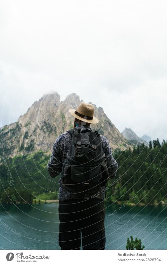 Man screaming in mountains Tourist Lake handsome bearded Nature Scream hands to mouth Freedom Vacation & Travel Lifestyle Backpack Mountain Landscape Water