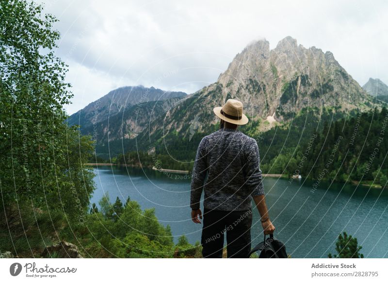 Man posing in mountains Tourist Lake handsome bearded Nature Freedom Vacation & Travel Lifestyle Backpack Mountain Landscape Water Youth (Young adults) Hiking