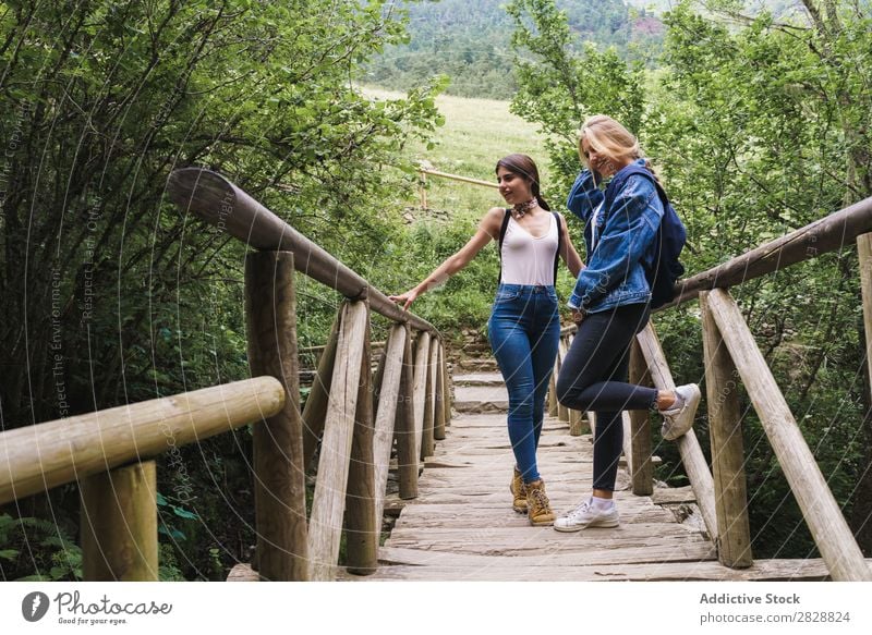Pretty women standing on bridge Woman Bridge Wood Nature Human being Summer Water Beautiful Beauty Photography Vacation & Travel Happiness Youth (Young adults)