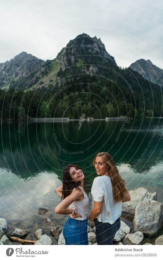 Women at lake in mountains Woman Mountain Walking Hiking Lake Water Smiling Cheerful Happy Vacation & Travel Adventure Tourist Youth (Young adults) Nature Trip