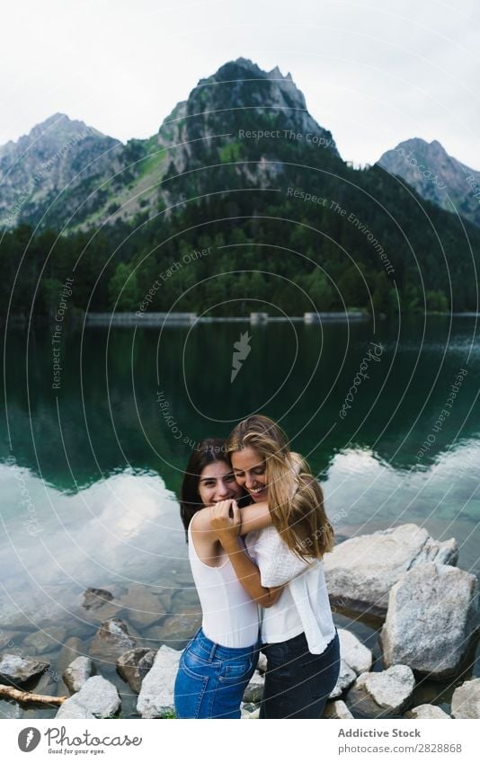 Women at lake in mountains Woman Mountain Walking Hiking Lake Water embracing Smiling Cheerful Happy Vacation & Travel Adventure Tourist Youth (Young adults)