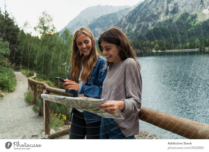 Women with map on mountain road Woman Street Mountain Walking Hiking Vacation & Travel Adventure Tourist Youth (Young adults) Nature Trip Leisure and hobbies