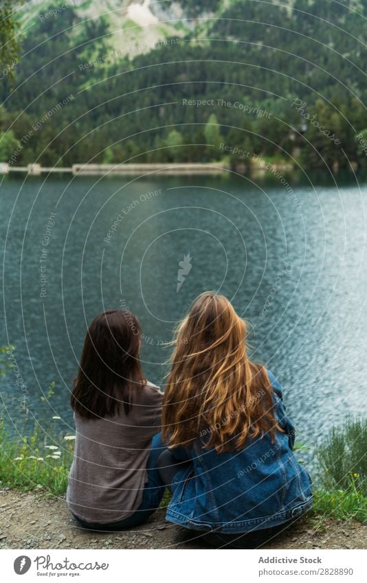 Women sitting at lake Woman Mountain Cheerful Sit Together Happy Hiking Lake Water Vacation & Travel Adventure Tourist Youth (Young adults) Nature Trip