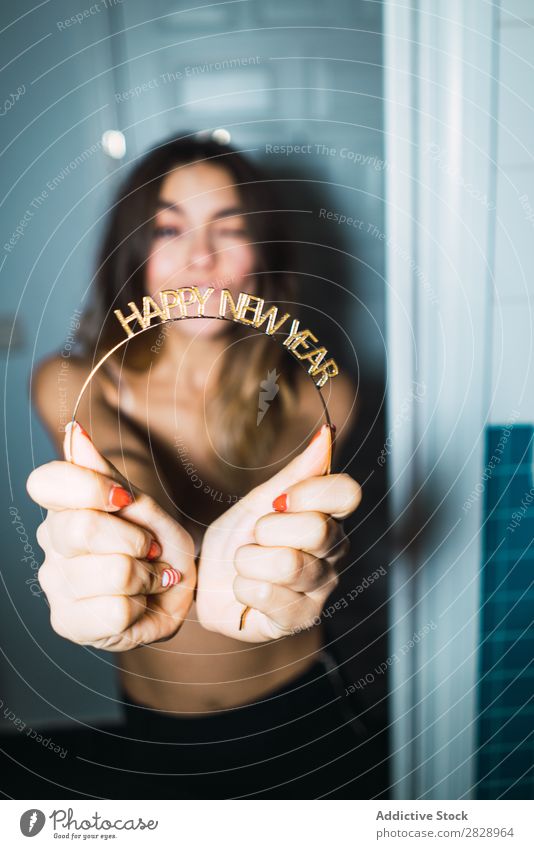 Woman with Happy New Year greeting Youth (Young adults) Attractive New Year's Eve Welcome Word Home Smiling Cheerful doorway Expressive Posture Alluring