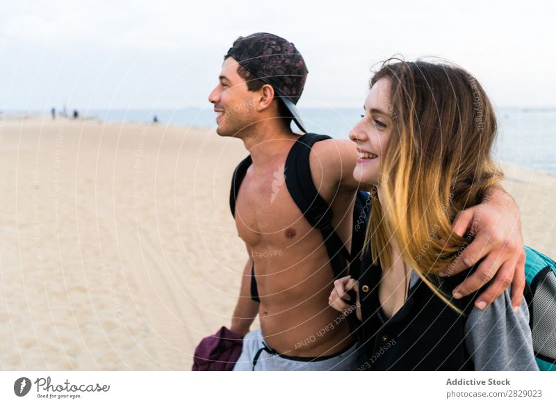 Happy couple on beach Couple Contentment Beach Embrace Athletic Cheerful Summer Exterior shot Happiness Wellness Walking Coast Sportswear Relaxation seaside