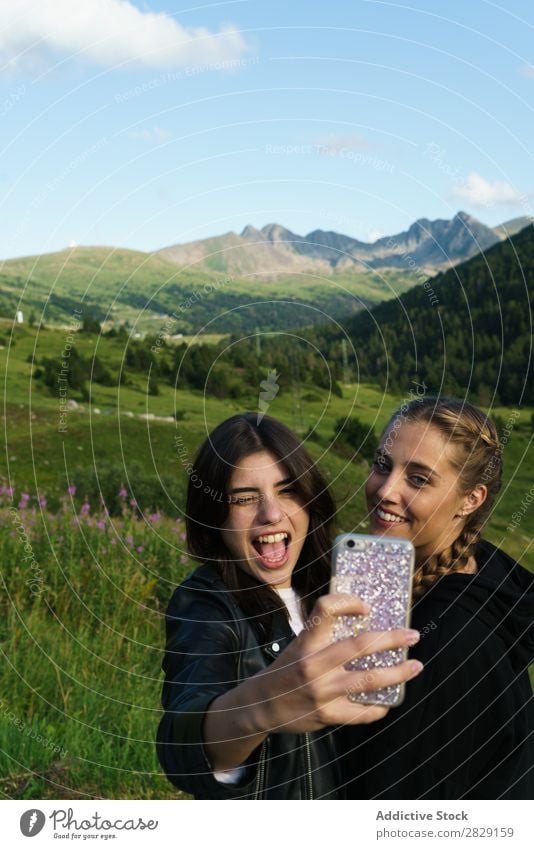 Women taking selfie on meadow Woman Selfie Meadow PDA Summer Youth (Young adults) Portrait photograph Grass Joy Mobile Nature Lifestyle pretty Posture Gadget