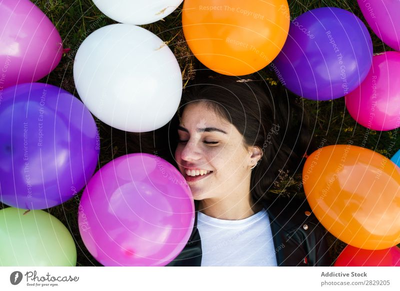 Pretty woman lying in balloons Woman Nature pretty Posture Lie (Untruth) Grass Smiling Laughter Freedom Joy Beautiful Human being Beauty Photography Happiness