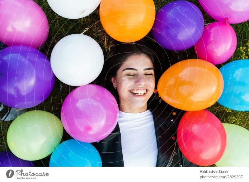 Pretty woman lying in balloons Woman Nature pretty Posture Lie (Untruth) Grass Smiling Laughter Freedom Joy Beautiful Human being Beauty Photography Happiness
