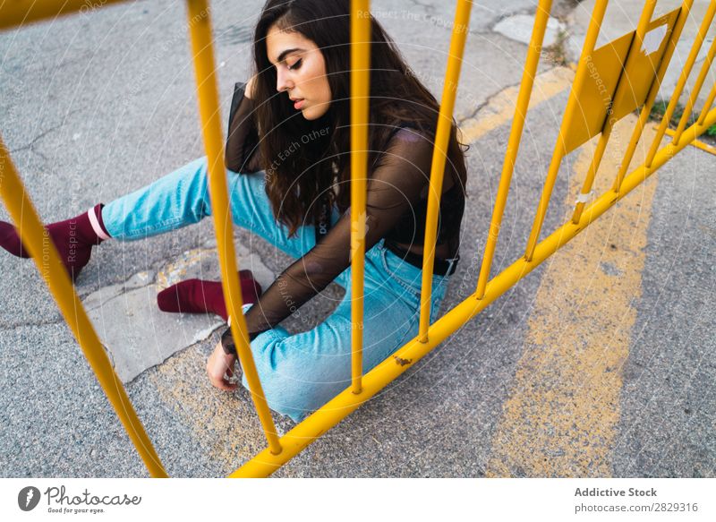 Woman sitting at fence Style Street Town Posture Sit Fence Asphalt Portrait photograph Attractive Beauty Photography Hip & trendy Lifestyle pretty Fashion