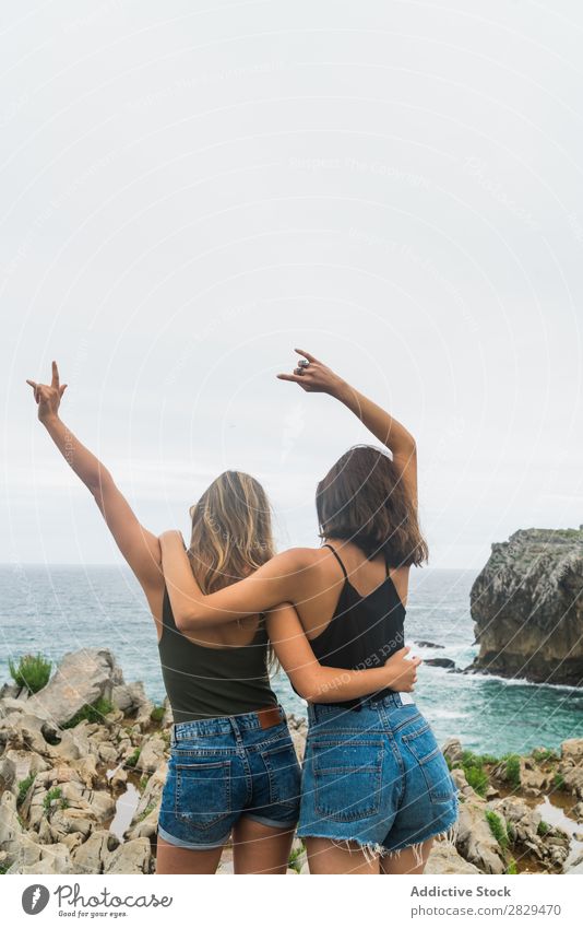 Women with arms raised standing on the cliff Woman Cliff Ocean Beautiful Rock Summer Nature Vacation & Travel Water Landscape Youth (Young adults) Blue