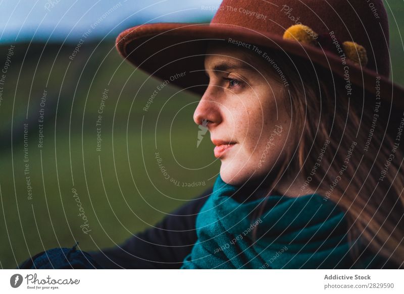 Dreamy woman standing at fence on field Woman Sit Field Green Nature Meadow Fence Stand Relaxation Rest Looking away Hat Spring Summer Grass Landscape