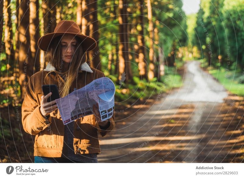Woman with map in woods Exterior shot scenery Forest Leaf Lost Colour Plant Day Natural Tourist Wild Beautiful Seasons Fresh Spring Multicoloured