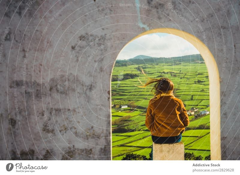 Woman in arch looking at field Arch Building Field Green Nature Meadow Spring Summer Grass Landscape Agriculture Rural Sunlight Farm Beautiful Lawn Environment