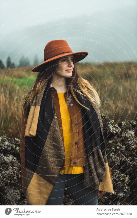 Stylish woman in misty mountains Woman Style Cold Fog Nature outerwear Clothing Tourism Lifestyle Rural Traveling Field Hat Exterior shot Countries