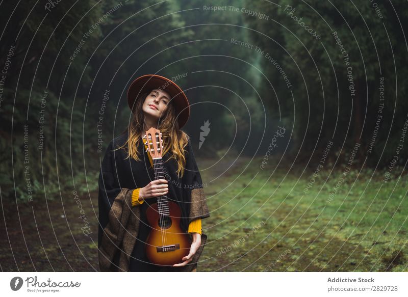 Charming woman with ukulele in nature Woman traveler Forest Ukulele Adventure Music Landscape Dream instrument Lifestyle Song Excitement Musician romantic