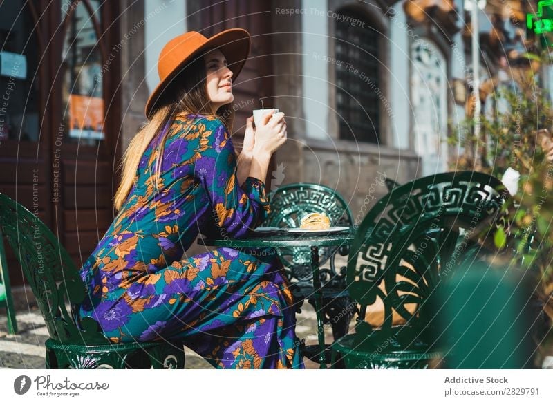 Smiling woman with cup in outside cafe Woman pretty Style Street Hat Coffee Cup Café Exterior shot Fashion Beautiful Youth (Young adults) Portrait photograph