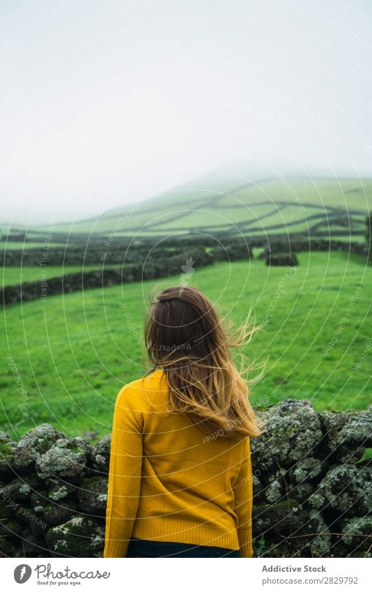 Woman at green field Field Green Vantage point Tourism Vacation & Travel Stand Smiling Nature Fence Landscape Stone Fog Grass Meadow Rural Clouds Seasons