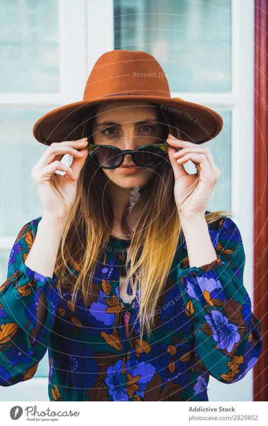 Cheerful stylish woman in hat Woman pretty Style Street Hat Walking Sunglasses Door Exterior shot Fashion Beautiful Youth (Young adults) Portrait photograph