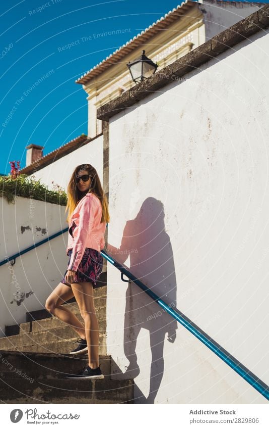 Young pretty woman on stairs Woman Style Street Sunglasses Steps Stairs Sunbeam Exterior shot Fashion Beautiful Youth (Young adults) Portrait photograph