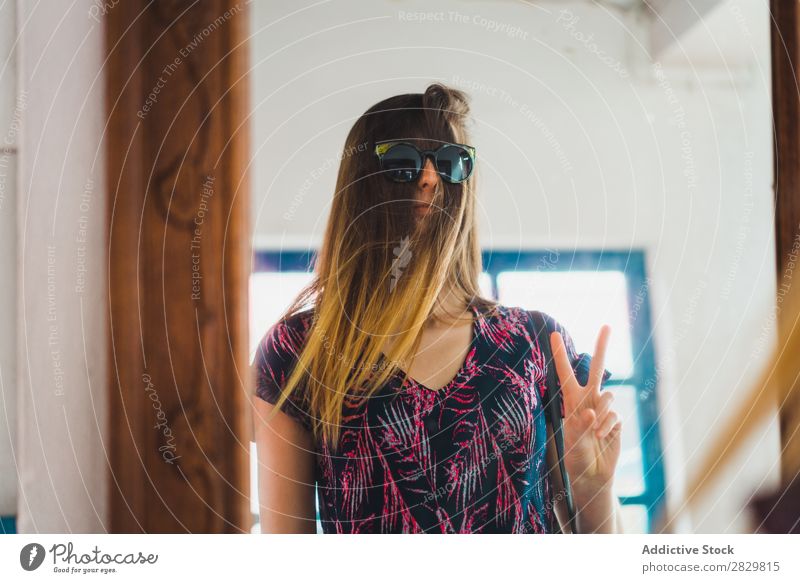 Woman with sunglasses over hair Reflection pretty Mirror Hair Sunglasses Gesture two fingers Success Beautiful Youth (Young adults) Beauty Photography