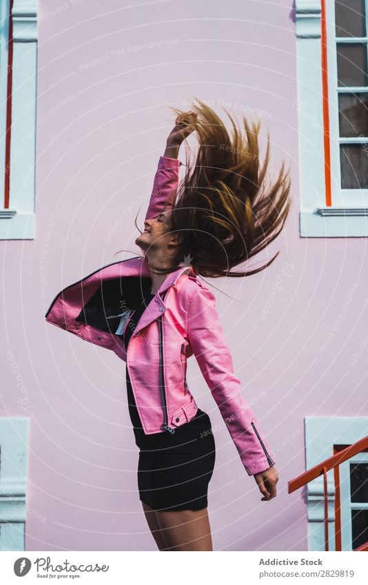 Happy woman with flying hair Woman pretty Style Hair Flying Jump Street Exterior shot Fashion Beautiful Youth (Young adults) Portrait photograph Attractive City