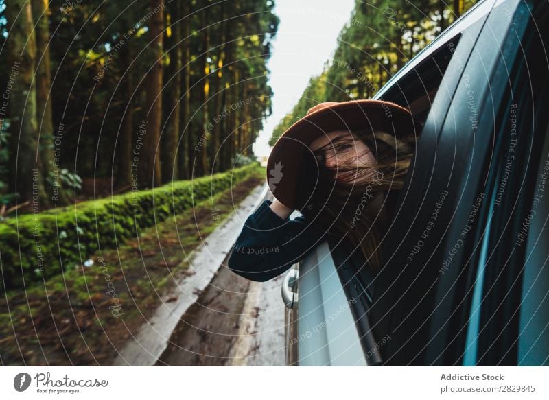 Woman hanging out of car in forest Car Window hang out Forest Green Dream Hat pretty Street Asphalt Nature Environment Natural Seasons Plant Leaf Light Fresh