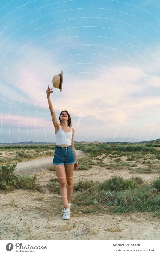 Woman throwing up hat in nature Field pretty throw up Hat Beautiful Girl Nature Beauty Photography Youth (Young adults) Summer Happy Portrait photograph Sand