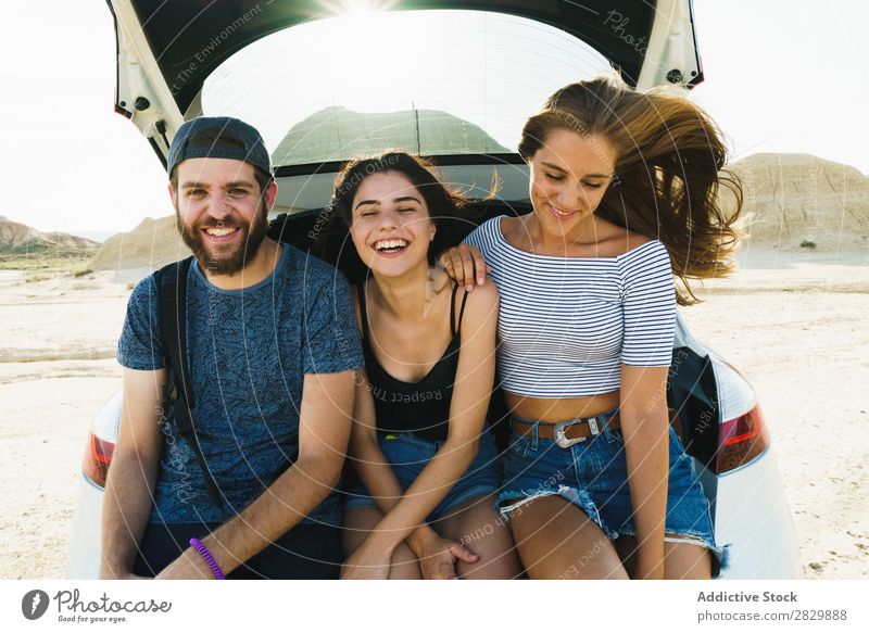 Friends sitting in car trunk Friendship Trunk Together Summer Human being Trip Joy Vacation & Travel Happy Adventure Lifestyle Youth (Young adults) Street