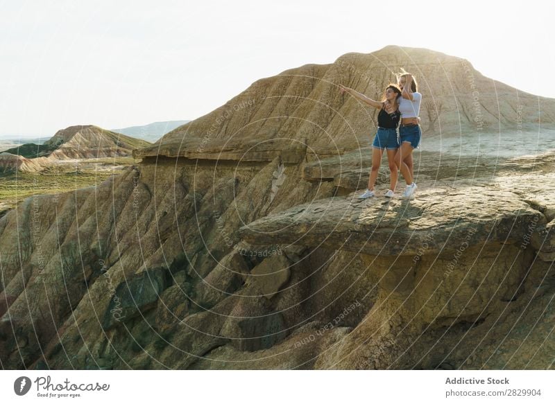 Excited women standing on cliff Woman Cliff Excitement Indicate embracing Embrace Freedom Vacation & Travel Success Top Mountain Youth (Young adults) Nature