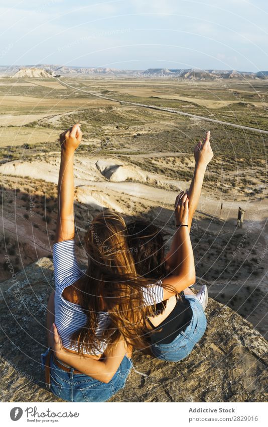 Excited women lying on cliff Woman Cliff Relaxation Vacation & Travel Adventure Rock Mountain Tourist Friendship Together Smiling Happy Excitement Freedom