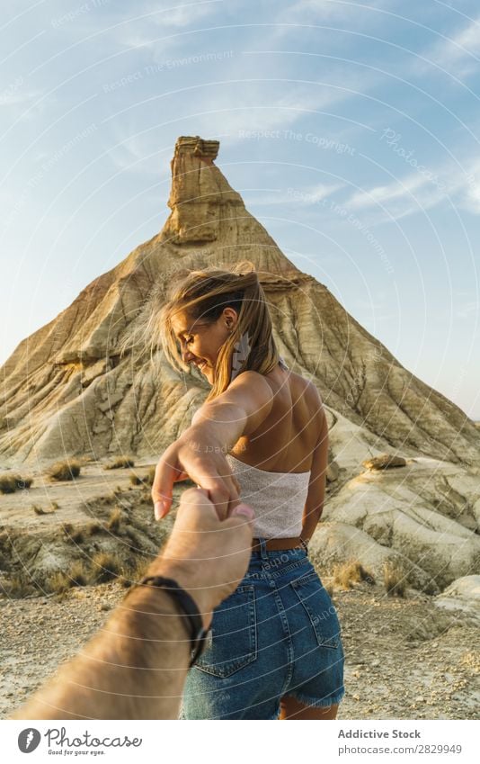 Woman holding hand of photographer at cliff Cliff follow me holding hands Gesture Photographer To enjoy pretty Youth (Young adults) Posture Beautiful Girl