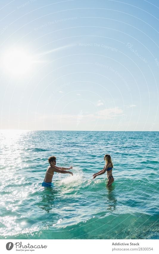 Couple posing in ocean water Ocean Swimming Summer Exotic romantic Water Love Tropical Beauty Photography enjoyment Sun Vacation & Travel Honeymoon Paradise