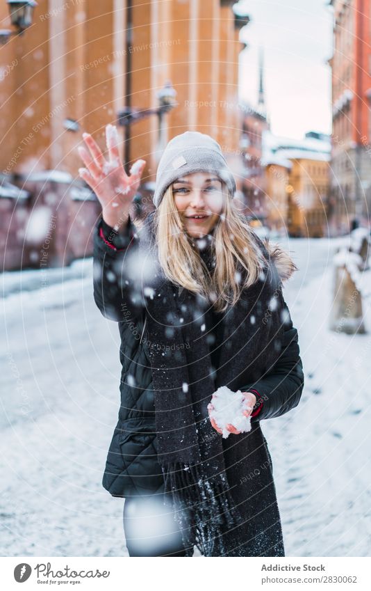 Woman throwing up snow Style Street Snow falling Joy fashionable To enjoy Youth (Young adults) pretty Winter Cold Cool (slang) Fashion warm clothes City Model