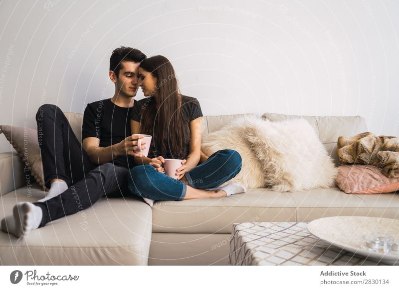 Couple sitting on couch Home Together Sit embracing Sofa Couch Cozy Human being Happy Love House (Residential Structure) Man Woman Lifestyle 2