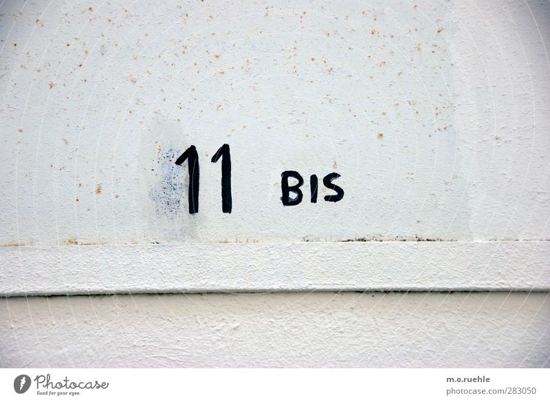 open end Wall (barrier) Wall (building) Facade Sign Characters Digits and numbers Esthetic Numbers 11 Colour photo Exterior shot Pattern Structures and shapes