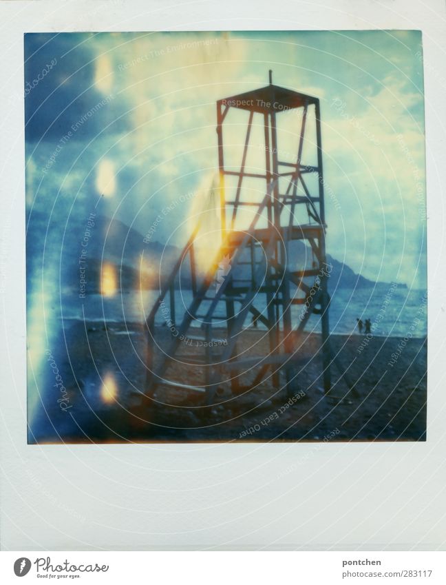 Surveillance tower on the beach. People taking a walk on the beach. Polaroid. Vacation Sand Beach Ocean Watch tower Tower Mountain To go for a walk