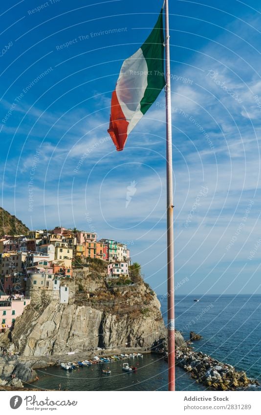 Flag waving on cityscape and sea Skyline Rock Landmark Countries Italian Landscape Destination Town national Cliff patriotic Vacation & Travel Italy Tourism