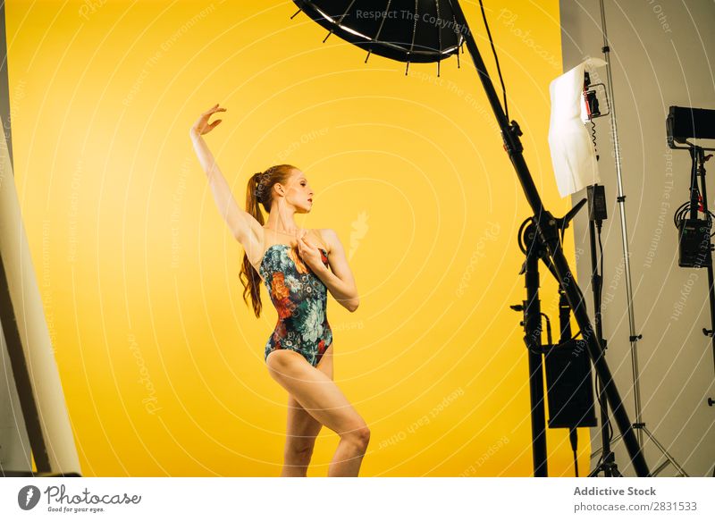 Pretty woman dancing in studio Woman pretty Portrait photograph Youth (Young adults) hand up Dance Ballet Dancer Red-haired Beautiful Adults Posture Smiling
